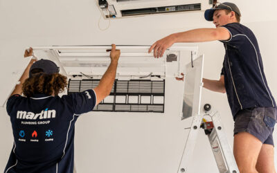 2 Technicians Installing Ceiling Vents For A Home Aircon Systems