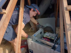 Technician Servicing A Brivis Gas Ducted Heater