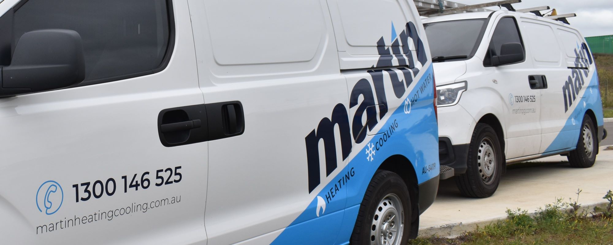 Martin Heating & Cooling vans with logo