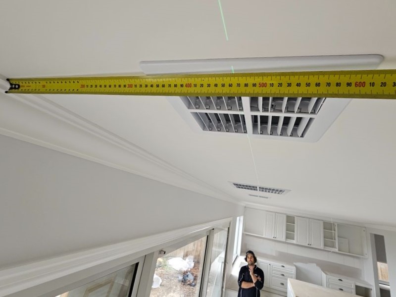 Double checking a new ducted aircon vent is straight